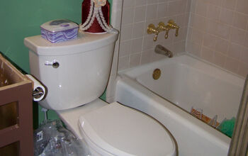 In-progress picture of updating a bath from 1970's GREEN fixtures + brass hardware to the current century.  The tub was…