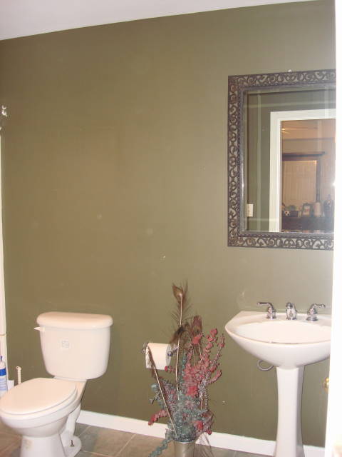 this project was a fairly large guest bathroom that was extremely plain because the, bathroom ideas, home decor, This guest bathroom is boring and drab We painted the walls a bold khaki green to liven up the