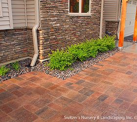 custom cedar arbor enhances home s front entrance and paver patio provides sitting, Interlocking concrete paver patio and walk