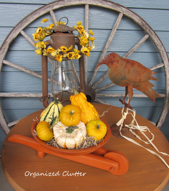 a rustic fall vignette in a wooden crate, seasonal holiday decor, I also painted a vintage wooden bowl wheelbarrow 2 at consignment shop today and filled it with gourds