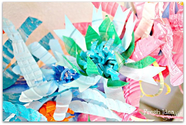 where are your empties go get em we re making upcycled blooms, crafts, repurposing upcycling, wreaths, You can paint them in a rainbow of colors and cut them into any shape or size you like