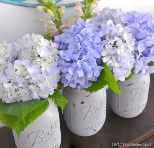 super easy painted mason jars with flowers, crafts, flowers, gardening, home decor, mason jars, I used regular gray latex paint with some added Plaster of Paris to help the paint adhere I brushed on two thin coats of paint to the exterior of the jar