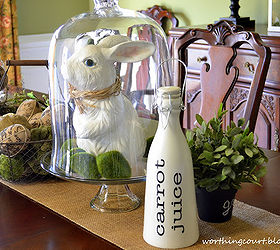 my burlapy and vintagey easter centerpiece, easter decorations, seasonal holiday d cor, A bunny with a raffia bow tie is keeping his eye on this bottle of carrot juice