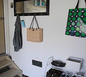 no mudroom i created one in my garage, There are plenty of hooks for jackets coats and my reusable shopping bags Shoes are stored on the wire organizer and on a boot tray