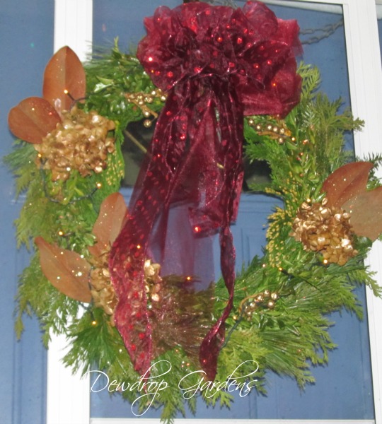 fresh greens wreath, christmas decorations, crafts, doors, seasonal holiday decor, wreaths, The finished wreath gets sprayed with Wilt Pruf to help it last longer