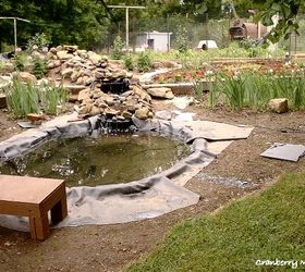 making an inexpensive garden pond, outdoor living, perennial, ponds water features, After digging a hole about 10 x 6 x 3 I lined it with old strips of discarded carpet to keep any rocks from creeping through and tearing the liner Then we put a piece of rubber roofing down folding it where necessary