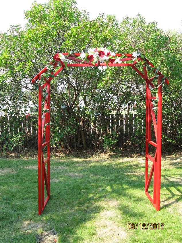 wedding arch from repurposed waterbed wood frame, outdoor living, repurposing upcycling, My son needed an arch for his wedding and he wanted to make it himself so we used a waterbed frame and this is what we created He will use it for deco in the yard with some flowers and a small bench now that the wedding is over