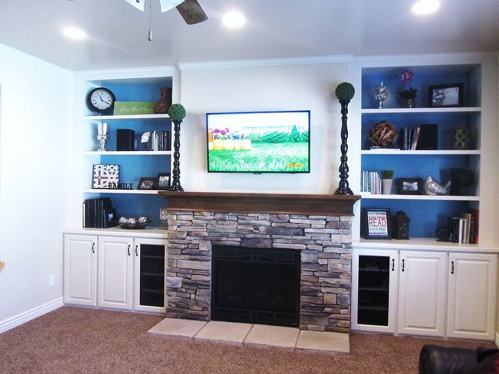 stone hearth fireplace and open background shelving unit, fireplaces mantels, kitchen cabinets, living room ideas, shelving ideas, Stone Hearth fireplace and open shelving built ins with blue background
