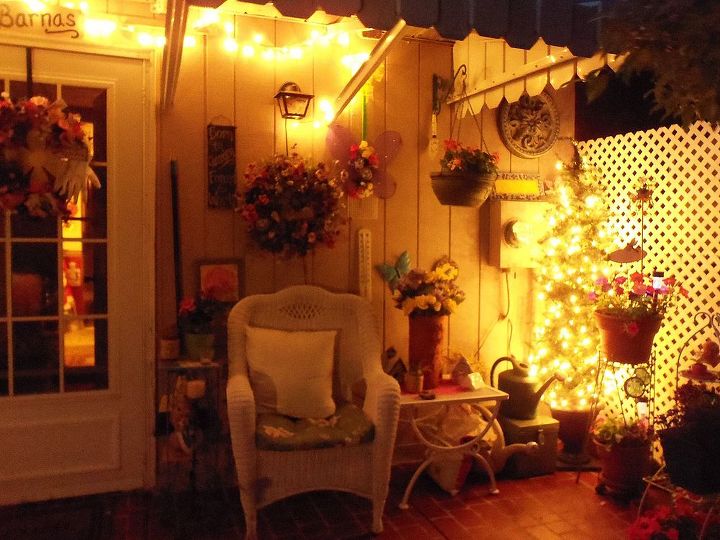 night time in the garden and patio, outdoor living, A potted Christmas tree with lights in the corner of the patio