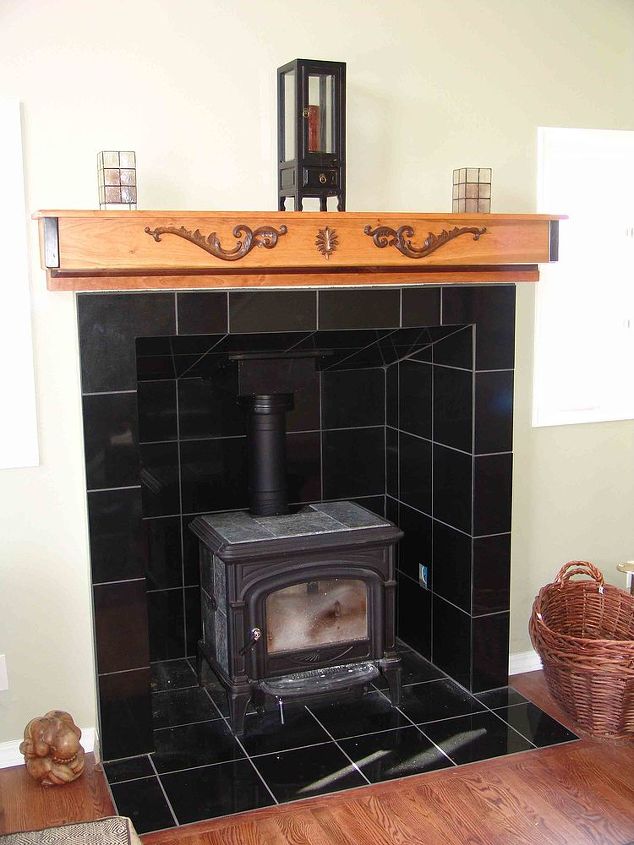 wood stove surround mantle, concrete masonry, Black Granite tile added some nice thermal mass for the soap stone stove Mantle is cherry with ebony trim at the corners