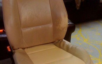 BMW seat showing partial panel replacement and wear area's before repair & dye.