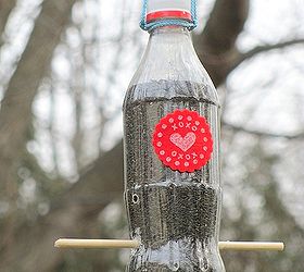 thistle bird feeder, gardening, A small Coke bottle turned into a thistle feeder