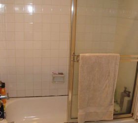 remodeling a small space is surely a challenge this 575 square foot condominium is, home decor, kitchen design, storage ideas, urban living, The tiled tub had existing water damage and we chose to replace it all with a Sterling Ensemble tub shower unit with new glass doors