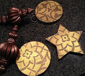 stenciled christmas tree ornaments, christmas decorations, crafts, seasonal holiday decor, It s so easy Paint a base coat of color and then stencil away with a different color on your ornaments Here I used gold and bronze metallic paints