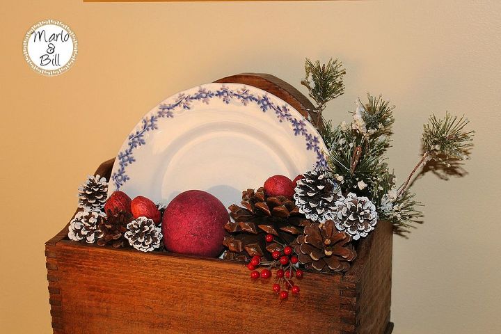 decking the halls with simplistic decor, christmas decorations, seasonal holiday decor, Old candle box adorned with pinecones snow sprayed greenery and some red decor