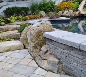 want to see an awesome pool and spa in a small backyard, landscape, outdoor living, ponds water features, pool designs, spas, Boulders stacked bluestone and Unilock pavers
