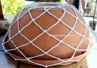 refinished old terra cotta pot with bb net, crafts