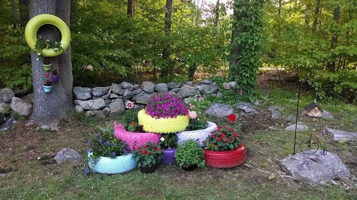 repurposed tires spray painted and turned into planters, gardening, repurposing upcycling