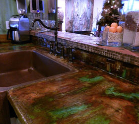 unusual bizzare kitchen project, home decor, kitchen cabinets, kitchen design, painting, Resurfaced countertops with mesh rewire and applied cement to surface Colored with concrete acid stain Dropped in copper apron sink and bridge faucet The stone work on countertop and stove backsplash is standard patio stone