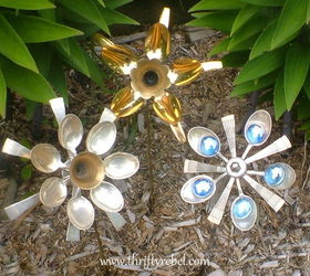 how to make cutlery flowers using spoons, crafts, flowers, gardening, repurposing upcycling, My cutlery flowers planted in the garden