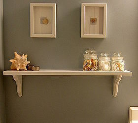 easy diy updates for simple and beachy bathroom, bathroom ideas, home decor, A DIY shelf and shell wall art lighten up the soft blue gray walls Find more details here