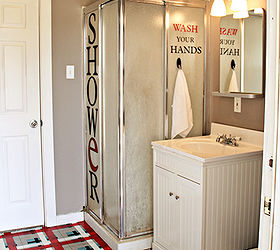 boys bathroom makeover, bathroom ideas, home decor, Vinyl words on the old pre fab shower make the ugliness disappear