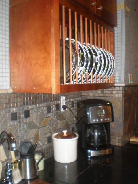kitchen renovation, home improvement, kitchen backsplash, kitchen design, I chose to have just a few upper cabs because of the closed in feel galley kitchens often have There are two upper cabinets for storage a plate rack and a wine rack Heavy duty drawers hold what doesn t go in the plate rack