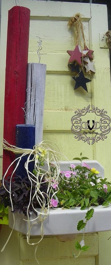 i made this adorable tnt decoration for the fourth of july for free, crafts, patriotic decor ideas, seasonal holiday decor, I think my fireworks look adorable sitting on the door with planterbox sink