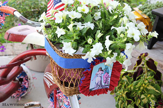 are you decorating your bike for the fourth of july, christmas decorations, flowers, gardening, patriotic decor ideas, repurposing upcycling, seasonal holiday d cor, I gathered up some crepe paper by sewing a straight line down the middle and pulling the ends and then glued a print on top of it from The Graphics Fairy