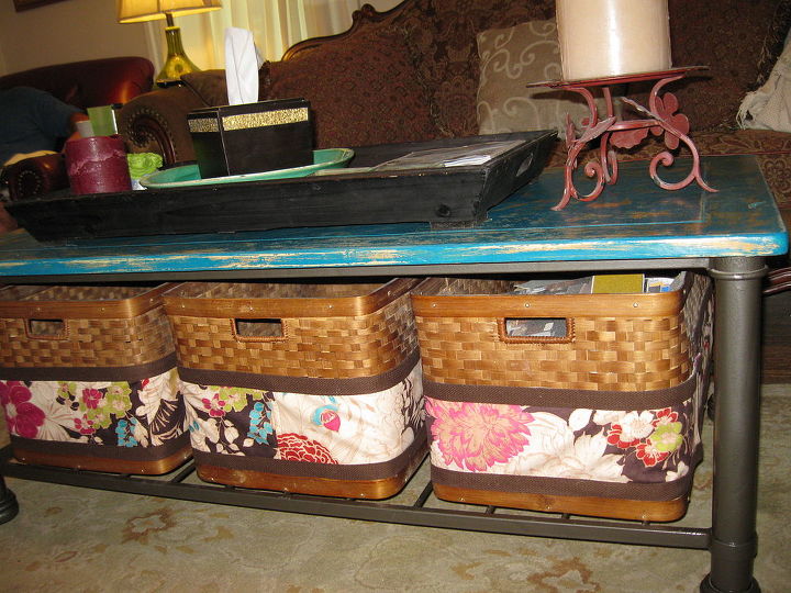 i did a makeover on my coffee table, painted furniture, storage ideas, My baskets had gotten kind of beaten up over the past 10 years but would have been impossible to replace because of their unique size So I created these slipcovers to hide the repair of corners that had worn through
