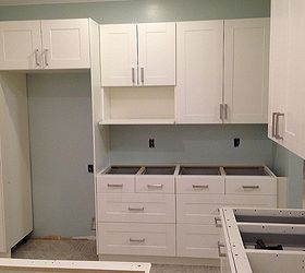 remodel of a kitchen for a dr in east tn, home improvement, kitchen design, IKEA cabinets with IKEA microwave shelf and IKEA filler boards on both sides of the stainless steel refrigerator for the custom look