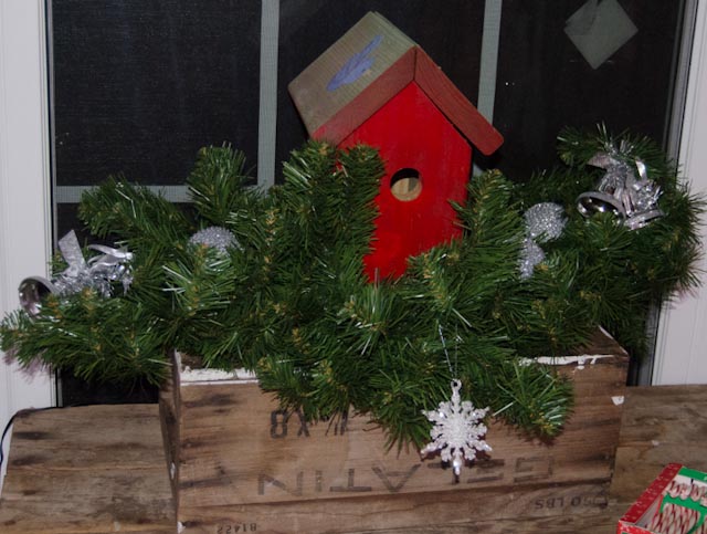 outside decorating, outdoor living, porches, seasonal holiday decor, Red birdhouse nestled in a little greenery