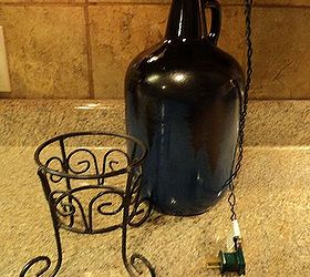starry night light, christmas decorations, crafts, lighting, seasonal holiday decor, 5 Put the lights into the bottle leaving the plug and enough length of the electrical cord to plug into outlet