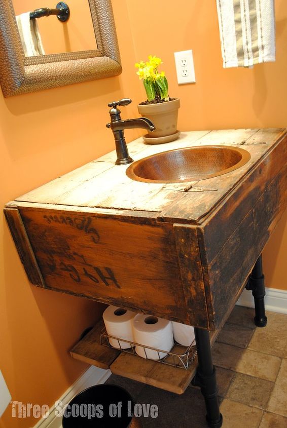 bathroom vanity from a wall cabinet, diy renovations projects, repurposing upcycling, We attached it to the wall with the plumbing flanges and hooked up our plumbing lines I added some barnwood pieces to act as a storage shelf resting on top of the pipe