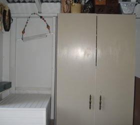 my little workshop, cleaning tips, craft rooms, The north wall The cabinet holds hand tools The white beadboard box on the bottom left hides the table saw on a cabinet for paint storage Wood is stored on the right of the cabinet