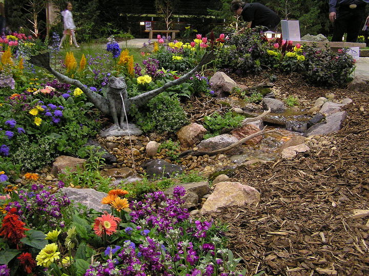 its garden and home show season in colorado, outdoor living, ponds water features, A frog spitter adds a bit of whimsy to this pondless waterfall