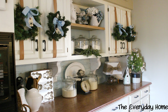 a farmhouse christmas, seasonal holiday d cor, Simple wreaths on cabinet doors and lots of white dishes filled to the brim with greenery and berries