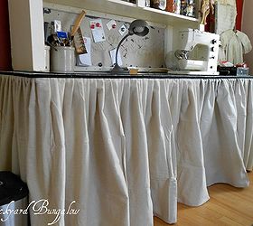 home office reveal, craft rooms, doors, home decor, home office, My husband and I made the table out of an old door and vintage table legs I used an old piece of ceiling tin to made the magnetic board and hid all my clutter underneath the table skirt made of drop cloth