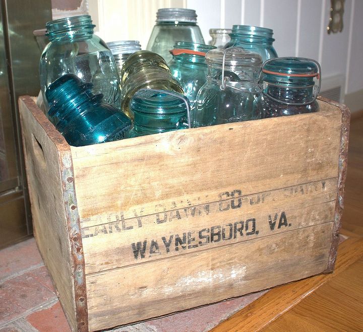 4th of july mantel with a vintage touch, patriotic decor ideas, seasonal holiday d cor, wreaths, A vintage crate from Early Dawn Dairy in Waynesboro VA is filled with telephone insulators and vintage jars