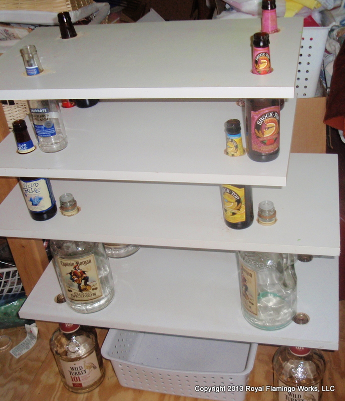 recycled liquor bottle shelf unit, repurposing upcycling, shelving ideas, storage ideas, You probably wouldn t want to display this shelf unit in your living room but it is serviceable for the basement attic or barn