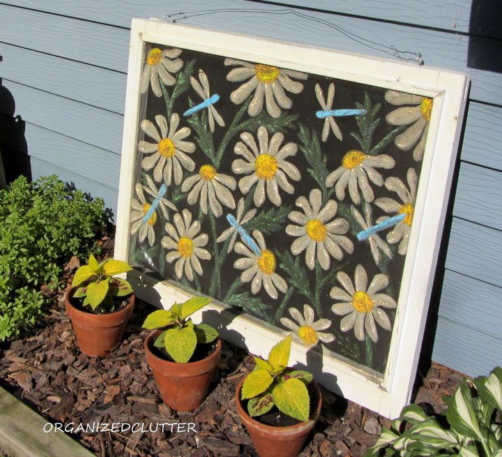 more outdoor garden junk decor, gardening, outdoor living, repurposing upcycling, An old dragonfly daisy window screen is propped up against the house with coleus in terra cotta pots