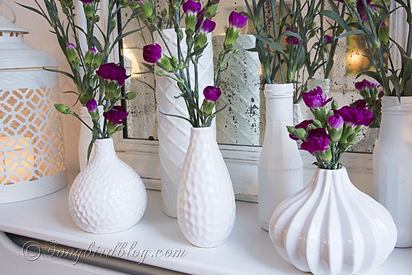 mid winter mantel decoration, crafts, flowers, seasonal holiday decor, A collection of white spray painted vases brings out the colors in your flowers