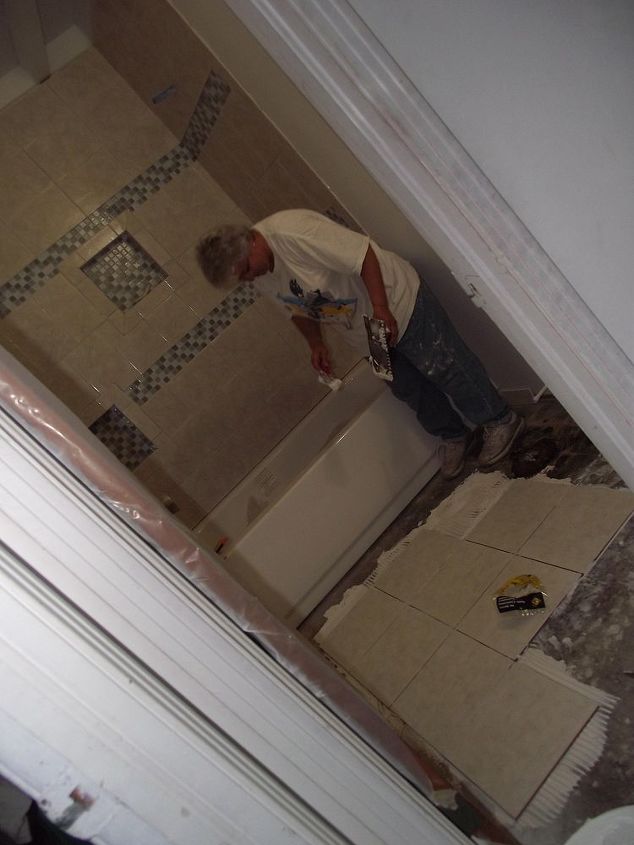 bathroom remodel, bathroom ideas, home improvement, Here she is laying the new floor