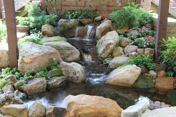 small water gardens, outdoor living, patio, ponds water features, This small pond and waterfall is tucked beside a patio situated under a deck A great solution for a spot that was once an eyesore