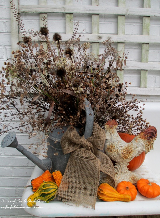 my favorite garden repurpose potting sink fountain, gardening, outdoor living, seasonal holiday decor, thanksgiving decorations, Thanksgiving dried seed heads pods in an old galvanized watering can