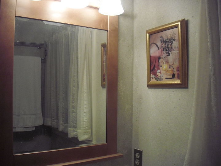 guest bathroom change, Mirror gives stucco a new appeal
