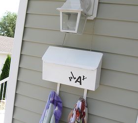playing with a mailbox for summer storage, cleaning tips, outdoor living, repurposing upcycling, The newspaper hooks work great for hanging towels