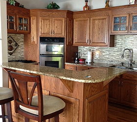transforming a lake house kitchen, home decor, home improvement, kitchen backsplash, kitchen design, Lake house kitchen I d like to change the look of the cabinets The backsplash is glass tiles and countertop is granite