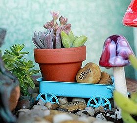 fairy garden, gardening, succulents, Tiny details An impossible small clay pot holds cuttings It rests inside a blue wagon that was once a Christmas ornament AugustGarden