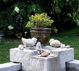 learn how to assemble this laguna deck pond plus fountain tips, outdoor living, ponds water features, Fountain decorated with colorful stones and plants